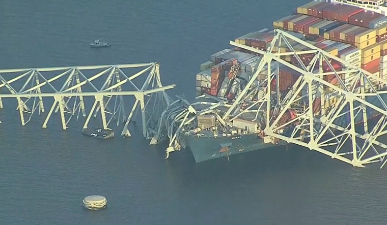 Baltimore bridge collapse: Two people rescued, tide hinders search efforts