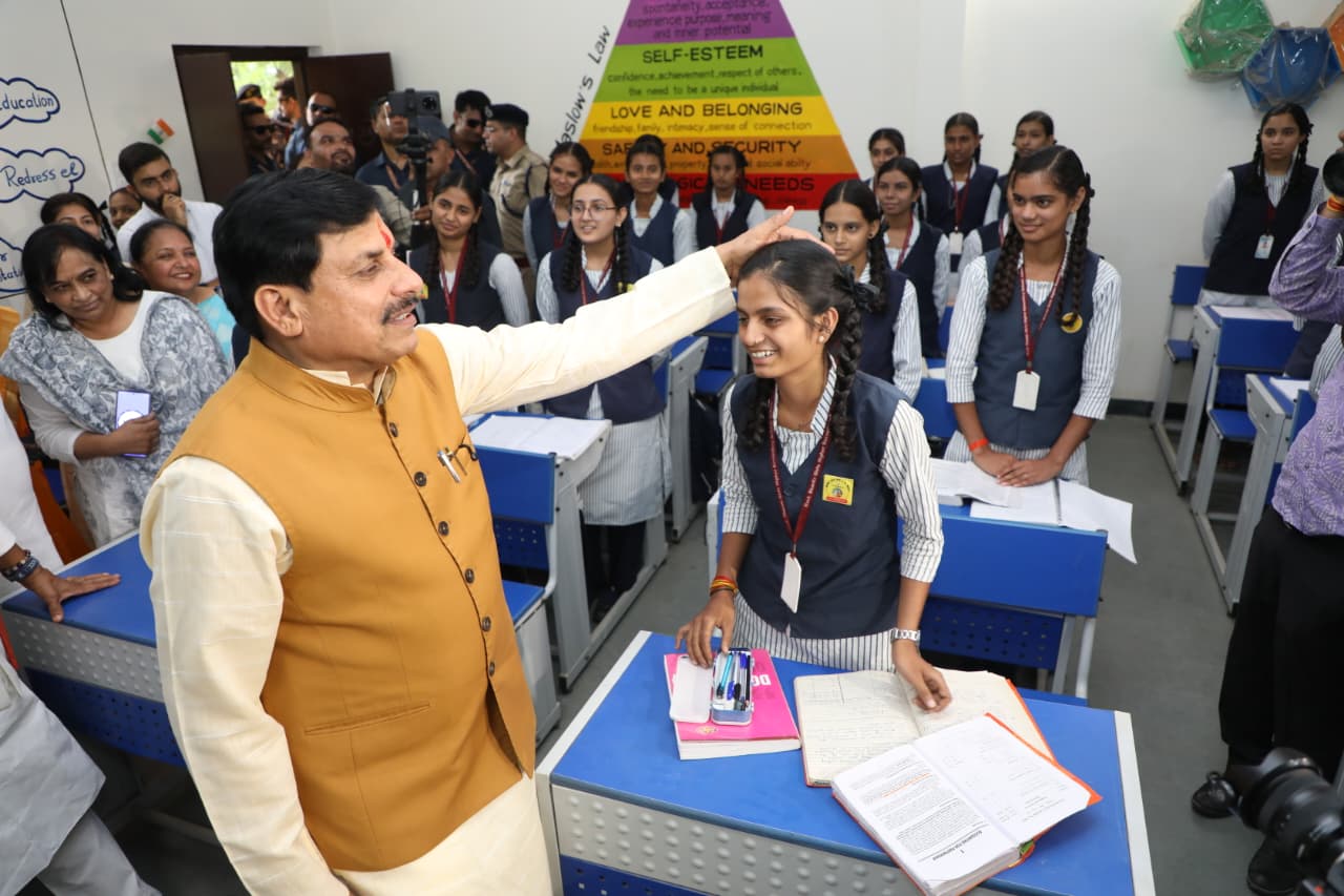 CM Mohan warmly interacts with schoolgirls on first day at school CM Mohan warmly interacts with schoolgirls on first day at school
