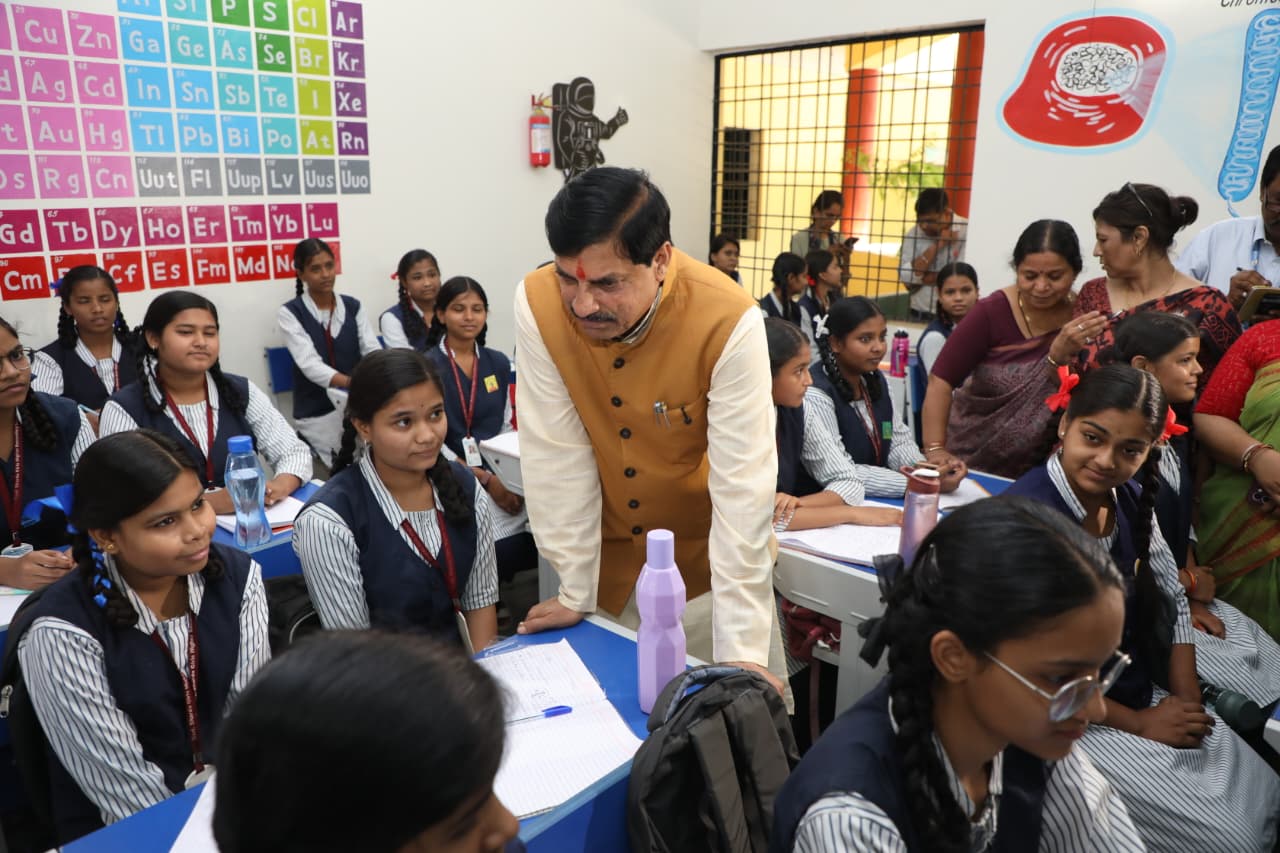 CM Mohan warmly interacts with schoolgirls on first day at school